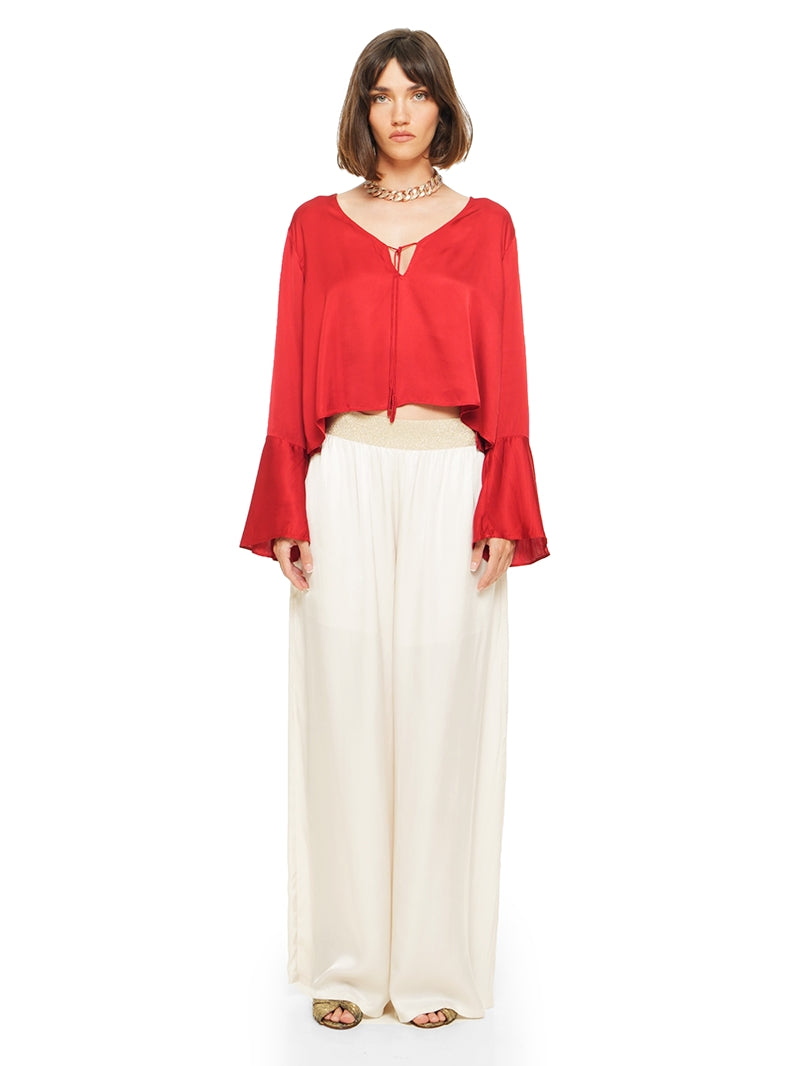 Nova pants in vanilla color styled with Rama top and Margot heels, front view - worn by model