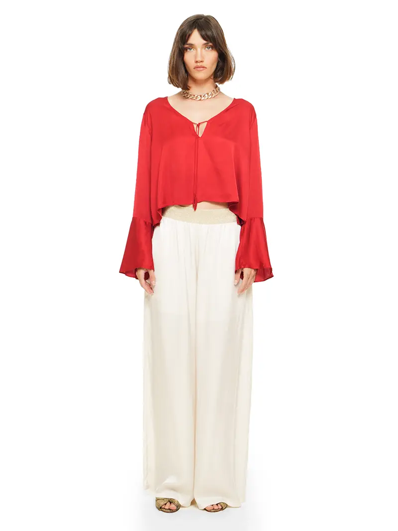 Nova pants in vanilla color styled with Rama top and Margot heels, front view - worn by model