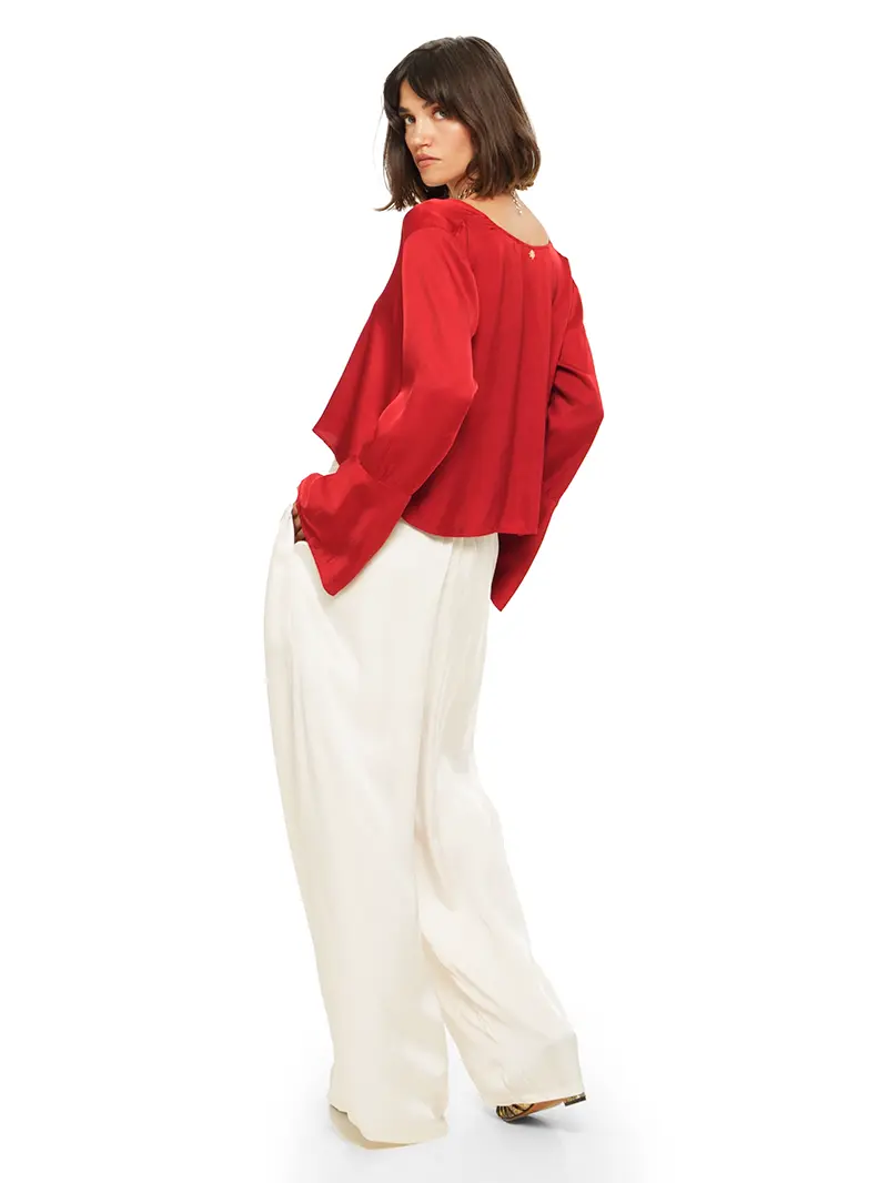 Nova pants in vanilla color styled with Rama top and Margot heels, back view - worn by model