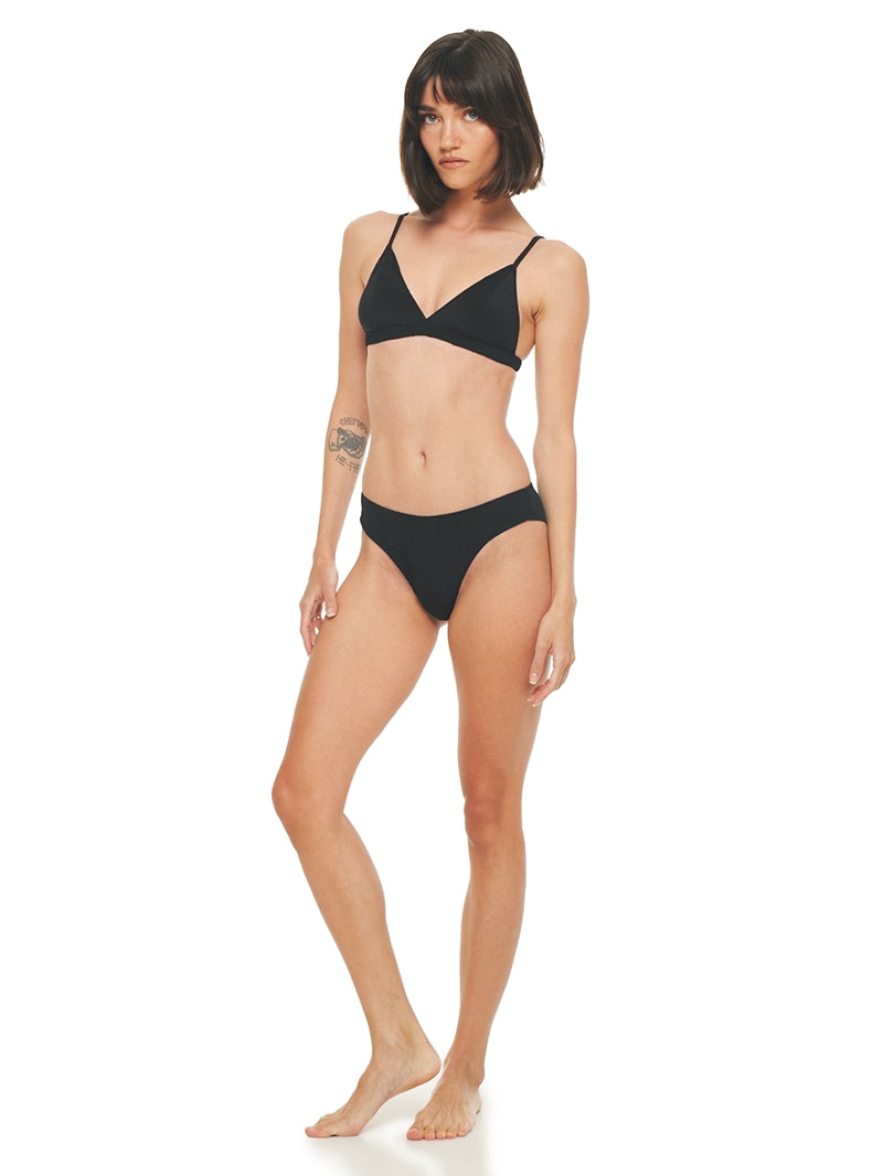 Polie bra and undies in black, front view - worn by model