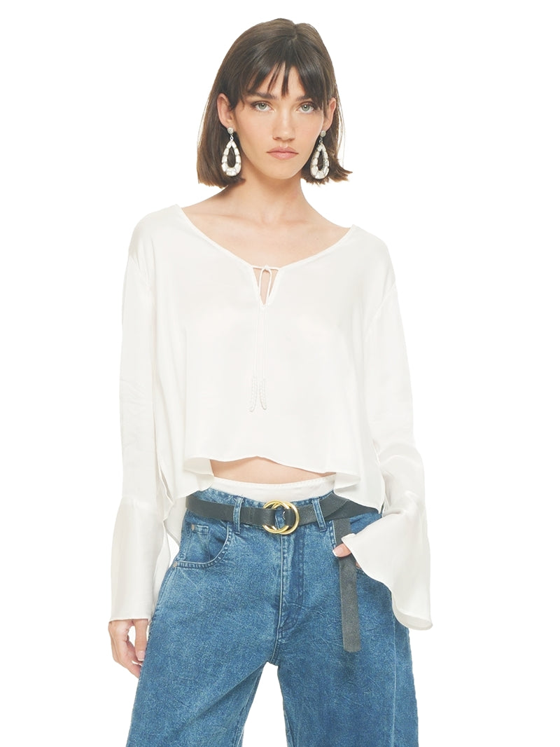 Rama top in natural color styled with Catch jeans pants, front close view - worn by model