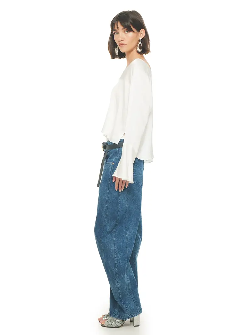 Rama top in natural color styled with Catch jeans pants and Margot heels, side view - worn by model