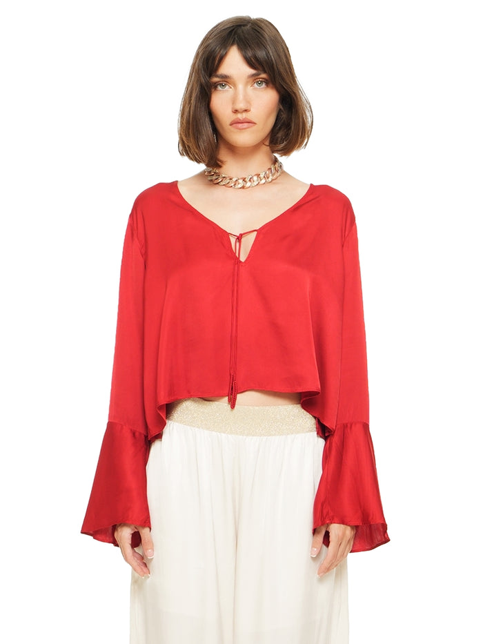 Rama top in red styled with Nova pants, front close view - worn by model