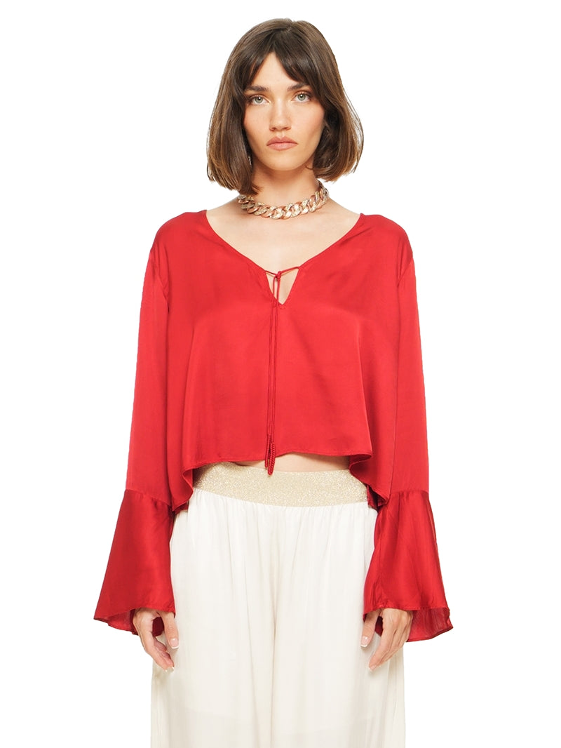 Rama top in red styled with Nova pants, front close view - worn by model
