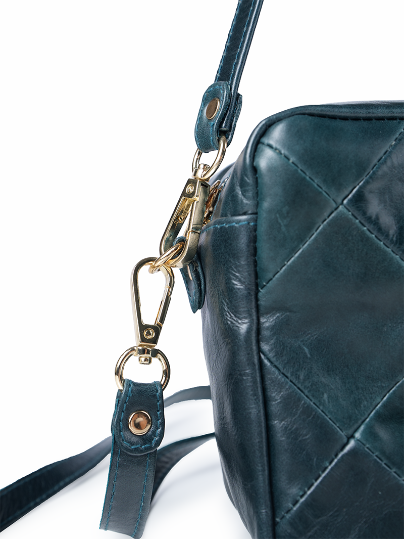 Rimba leather shoulder bag with a diamond-quilted pattern, featuring matching detachable shoulder and crossbody straps with gold-tone hardware - ghost closeup hardware details view