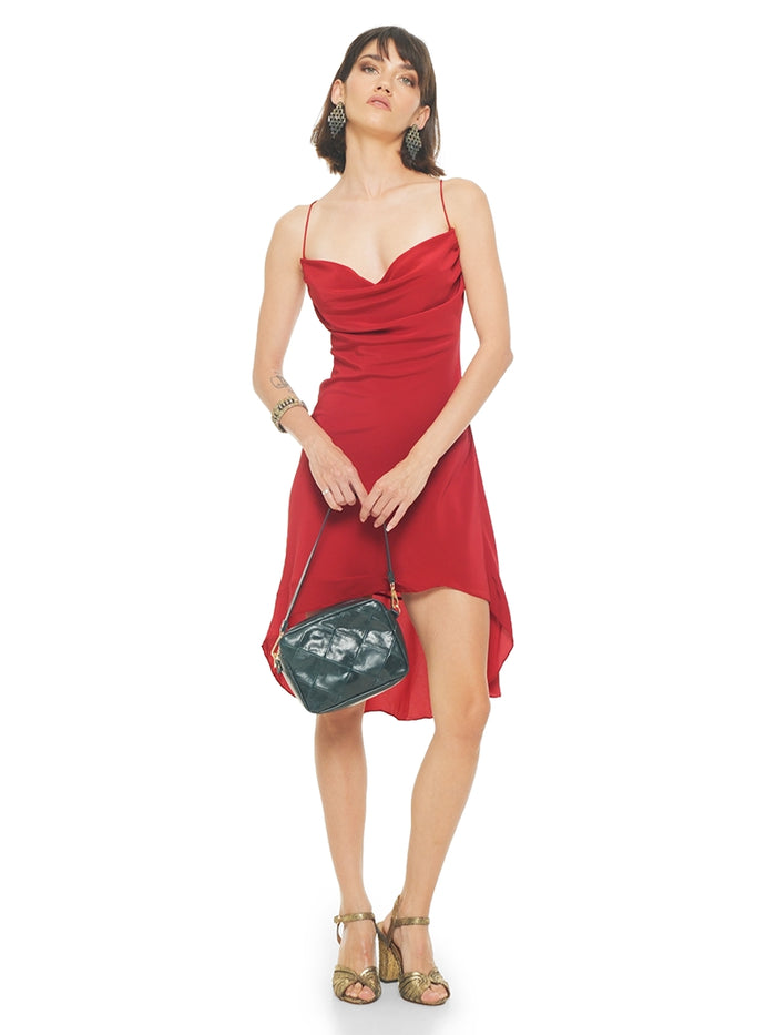 Maz mini dress in red styled with Margot heels and Rimba bag pine green, front view - worn by model