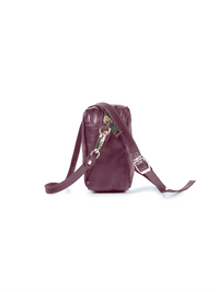 Rimba leather shoulder bag with a diamond-quilted pattern, featuring matching detachable shoulder and crossbody straps with gold-tone hardware - ghost side view