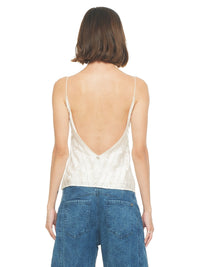 Selma beaded top in natural color, styled with Catch jeans pants, back view - worn by model
