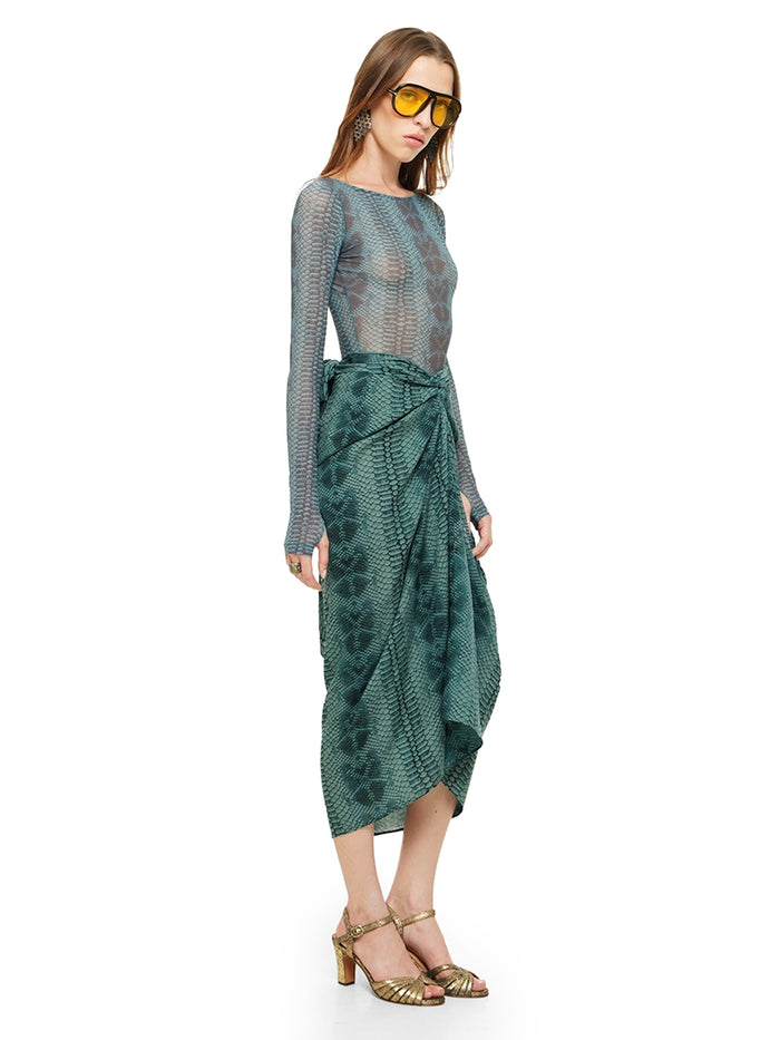 Shakti midi skirt in snake blue print styled with Boga bodysuit and Margot heels, quarter side view - worn by model