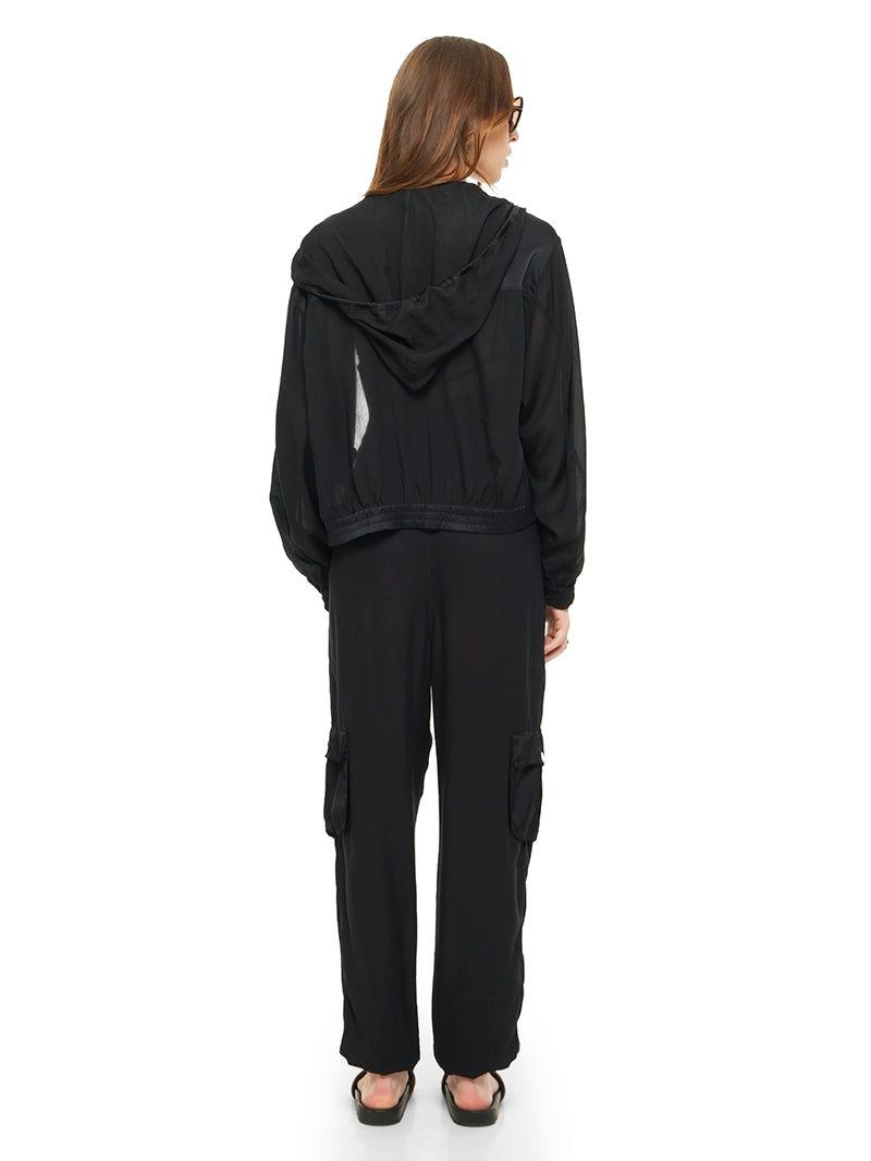 Sheer bomber jacket in black styled with Dega bodysuit, Cargo pants and Flaviana sildes, back view - worn by model