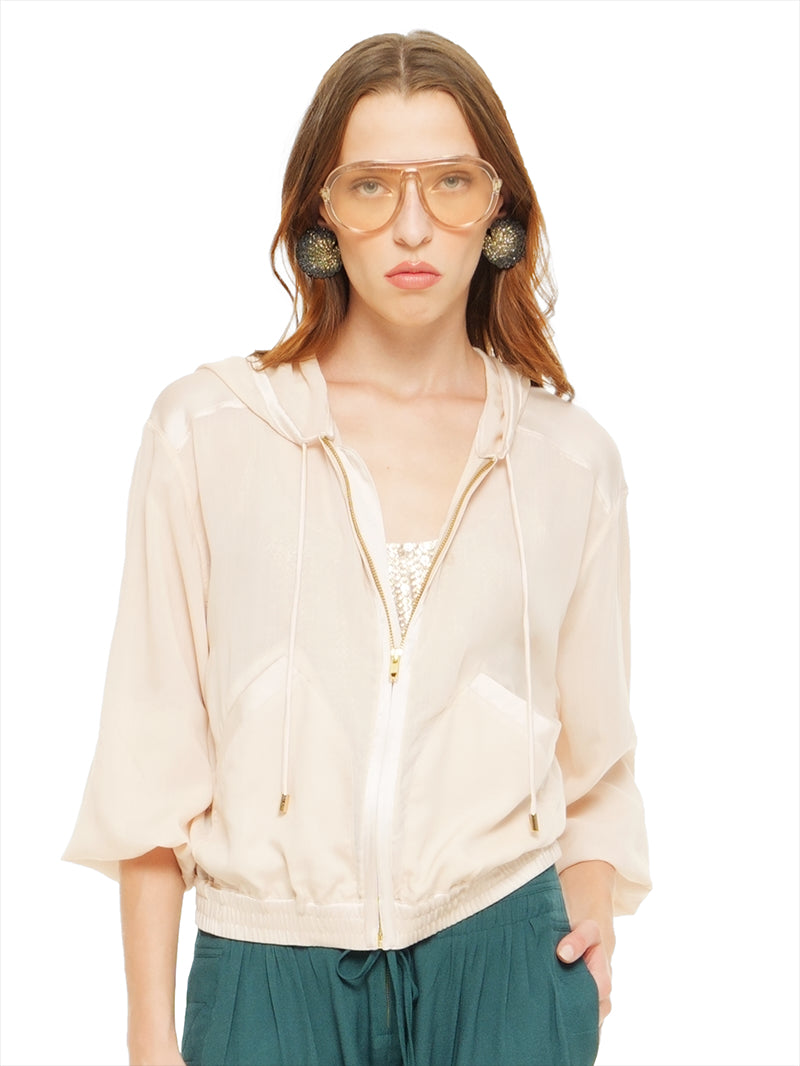 Sheer bomber jacket in blush styled with Hora beaded top and Luma pants, front view - worn by model