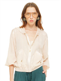 Sheer bomber jacket in blush styled with Hora beaded top and Luma pants, front view - worn by model