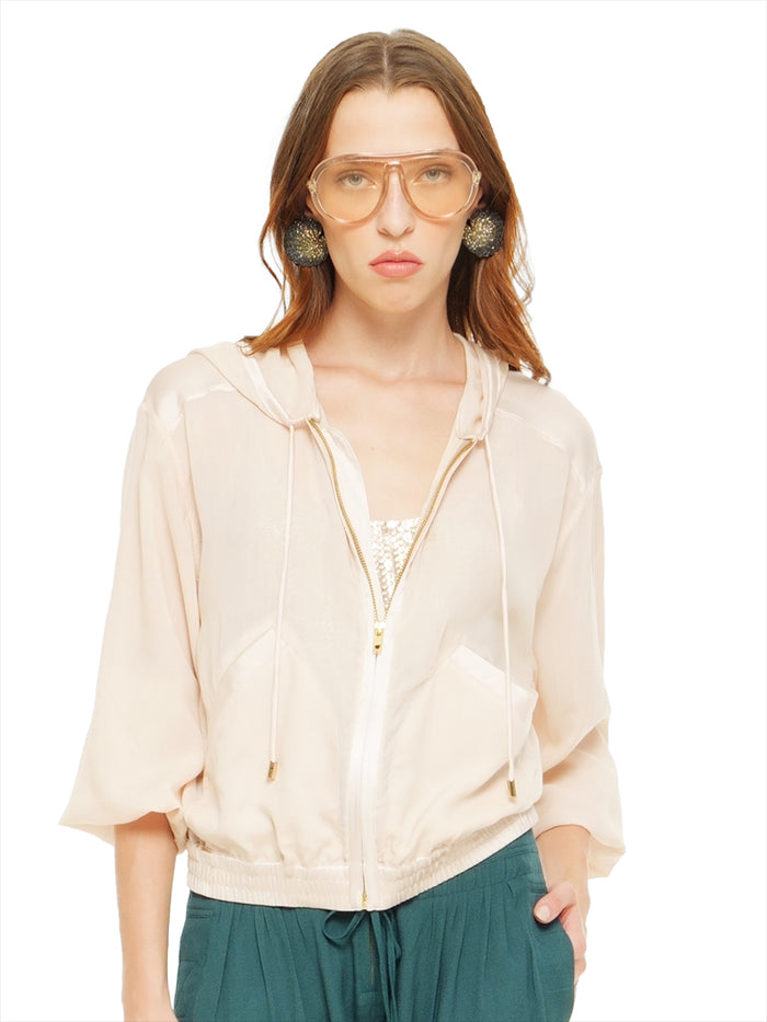 Sheer bomber jacket in blush styled with Hora beaded top and Luma pants, front view - worn by model