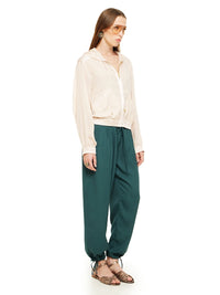Sheer bomber jacket in blush styled with Luma pants and Margot flats, quarter front view - worn by model