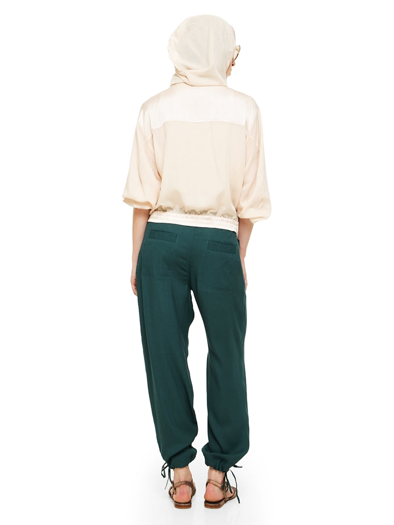 Sheer bomber jacket in blush styled with Luma pants and Margot flats, back view - worn by model