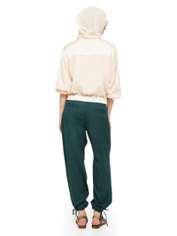 Sheer bomber jacket in blush styled with Luma pants and Margot flats, back view - worn by model