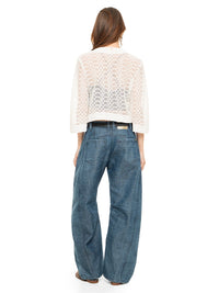 Snake bolero in white styled with Maz top black, Snap jeans pants, and Margot flats, front view - worn by model