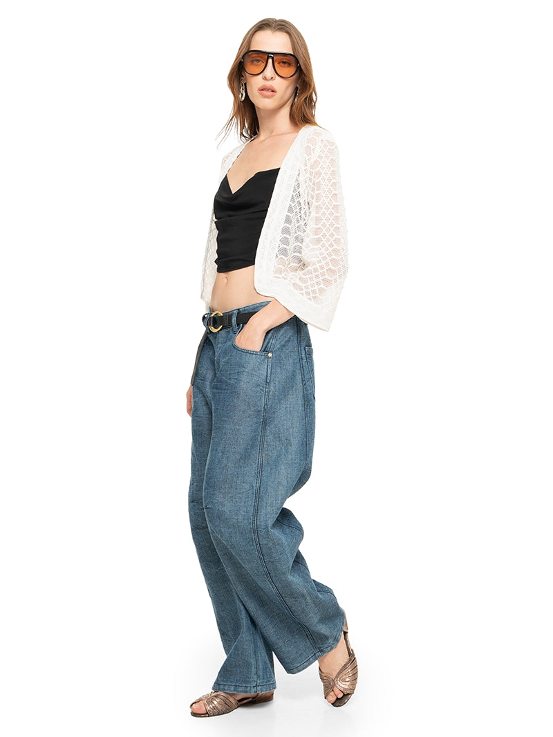 Snake bolero in white styled with Maz top black, Snap jeans pants, and Margot flats, side view - worn by model