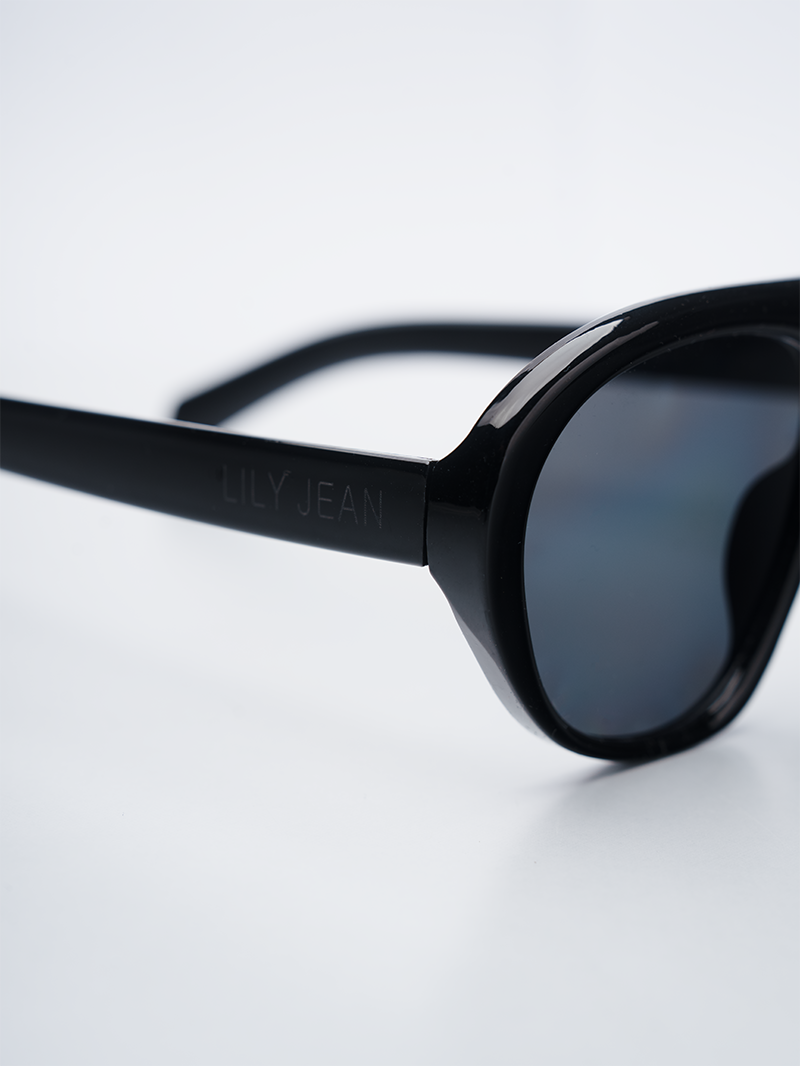 Square-aviator black sunglasses with dark gray lenses - close-up view