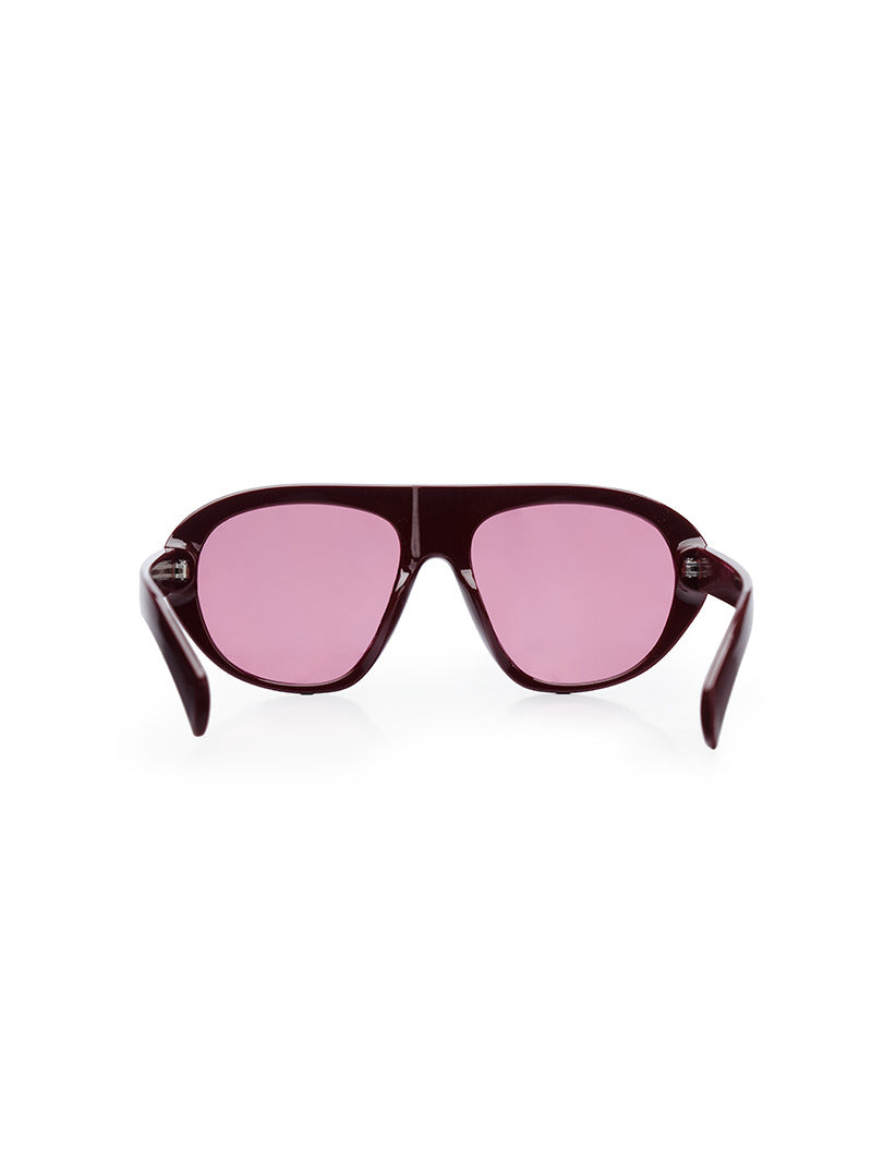A pair of oversized sunglasses with pink-tinted lenses and a dark burgundy frame - back view
