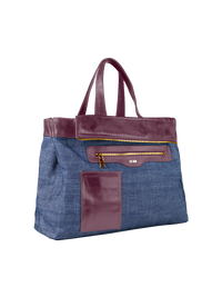 Victoria tote bag in wine color featuring a blue denim inner reversible side with contrasting leather trim - ghost front view